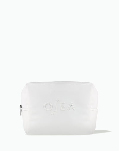 OSEA white zippered cosmetic bag with embossed logo on white background for ecommerce display